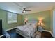 Spacious bedroom with a queen-size bed and dark hardwood floors at 2901 26Th W St # 320, Bradenton, FL 34205