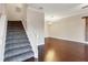 Staircase with carpeted steps and hardwood floors at 3309 10Th W Ln, Palmetto, FL 34221