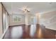 Bright living room with hardwood floors, sliding door to balcony, and barn door accent at 3309 10Th W Ln, Palmetto, FL 34221