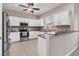 Modern kitchen with white cabinets, granite countertops, and stainless steel appliances at 3309 10Th W Ln, Palmetto, FL 34221