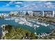 Aerial view showing a marina with yachts and boats, and the skyline of the city at 455 Park Trace Blvd, Osprey, FL 34229