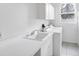 Laundry room featuring a sink, washer, and dryer at 455 Park Trace Blvd, Osprey, FL 34229