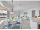 Inviting living space with lake views, featuring a dining area and seating area at 455 Park Trace Blvd, Osprey, FL 34229