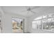 Bright sunroom overlooking the pool area with large arched windows at 455 Park Trace Blvd, Osprey, FL 34229