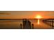 Sunset over the water highlighting the dock at 455 Park Trace Blvd, Osprey, FL 34229
