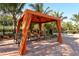 Shaded cabana with comfortable lounge chairs near the pool at 5870 Cavano Dr, Sarasota, FL 34231