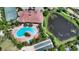 Aerial view of community pool, tennis courts, and more at 5870 Cavano Dr, Sarasota, FL 34231