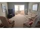Spacious living room with comfortable seating and a large TV at 611 Gulf N Dr # D24, Bradenton Beach, FL 34217