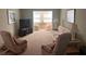 Bright living room with comfy seating and a view to another room at 611 Gulf N Dr # D24, Bradenton Beach, FL 34217