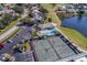 Aerial view of community pool and tennis courts with parking at 6591 Fairway Gardens Dr # 2-102, Bradenton, FL 34203