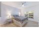 Bright bedroom with large windows and geometric patterned bedding at 6591 Fairway Gardens Dr # 2-102, Bradenton, FL 34203