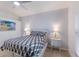 Spacious bedroom with a queen bed, nightstands, and ceiling fan at 6591 Fairway Gardens Dr # 2-102, Bradenton, FL 34203