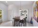 Bright dining area with a wooden table and four chairs at 6591 Fairway Gardens Dr # 2-102, Bradenton, FL 34203