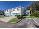 Two-story building with attached garages and landscaping at 6591 Fairway Gardens Dr # 2-102, Bradenton, FL 34203