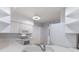 White kitchen with ample cabinetry and a built-in microwave at 6591 Fairway Gardens Dr # 2-102, Bradenton, FL 34203