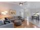 Open living and dining area with hardwood floors and sectional sofa at 6591 Fairway Gardens Dr # 2-102, Bradenton, FL 34203