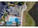 Community pool with lounge chairs and covered areas at 6591 Fairway Gardens Dr # 2-102, Bradenton, FL 34203