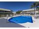 Refreshing community pool surrounded by lush landscaping at 6591 Fairway Gardens Dr # 2-102, Bradenton, FL 34203