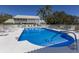 Inviting community pool with ample lounge chairs at 6591 Fairway Gardens Dr # 2-102, Bradenton, FL 34203