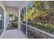 Spacious screened porch overlooking a lush, green backyard at 6591 Fairway Gardens Dr # 2-102, Bradenton, FL 34203