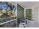 Relaxing screened porch with seating area, perfect for enjoying the outdoors at 6591 Fairway Gardens Dr # 2-102, Bradenton, FL 34203