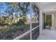 Bright and airy screened porch with view of the trees and landscape at 6591 Fairway Gardens Dr # 2-102, Bradenton, FL 34203