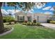 One-story home with green landscaping and driveway at 7144 Spikerush Ct, Lakewood Ranch, FL 34202