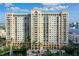 Multi-story building with balconies and water view at 750 N Tamiami Trl # 302, Sarasota, FL 34236