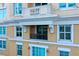 Private balcony with stone balustrade and metal railing at 750 N Tamiami Trl # 302, Sarasota, FL 34236