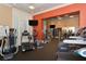 Well-equipped fitness center with various cardio and strength training machines at 750 N Tamiami Trl # 302, Sarasota, FL 34236