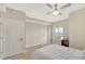 Bedroom with full-size bed, ceiling fan and window with natural light at 750 N Tamiami Trl # 302, Sarasota, FL 34236