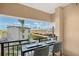 Private balcony with city views and a small table at 750 N Tamiami Trl # 302, Sarasota, FL 34236