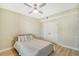 Bright bedroom with full-size bed, ceiling fan and ample closet space at 750 N Tamiami Trl # 302, Sarasota, FL 34236