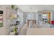 Casual dining area with a triangular table and large windows at 750 N Tamiami Trl # 302, Sarasota, FL 34236