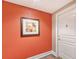 Apartment entryway with orange walls and white door at 750 N Tamiami Trl # 302, Sarasota, FL 34236