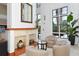 Cozy lobby with fireplace, seating area, and large windows at 750 N Tamiami Trl # 302, Sarasota, FL 34236