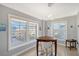 Bright dining area with corner table and chairs, plus large windows at 750 N Tamiami Trl # 302, Sarasota, FL 34236
