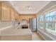 Modern kitchen with stainless steel appliances and white countertops at 750 N Tamiami Trl # 302, Sarasota, FL 34236