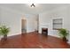 Living room with fireplace, hardwood floors, and built-in shelving at 903 W Reynolds St, Plant City, FL 33563