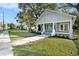 Charming house exterior with a green facade, porch, and well-maintained lawn at 903 W Reynolds St, Plant City, FL 33563