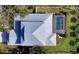 Aerial view of house with metal roof and pool at 2492 S Milmar Dr, Sarasota, FL 34237