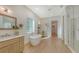 Elegant bathroom with freestanding tub, walk-in shower, and double vanity at 2492 S Milmar Dr, Sarasota, FL 34237
