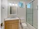 Clean bathroom with light wood vanity, quartz countertop, and glass shower at 2492 S Milmar Dr, Sarasota, FL 34237