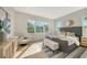 Spacious bedroom with large windows and cozy sitting area at 2492 S Milmar Dr, Sarasota, FL 34237