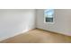 Spacious bedroom with hardwood floors and a window offering natural light at 2492 S Milmar Dr, Sarasota, FL 34237