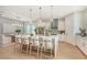 Modern kitchen with white cabinets, island, and breakfast bar at 2492 S Milmar Dr, Sarasota, FL 34237