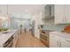Modern kitchen with stainless steel appliances and white cabinets at 2492 S Milmar Dr, Sarasota, FL 34237