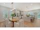 Bright kitchen with island, stainless steel appliances, and dining area at 2492 S Milmar Dr, Sarasota, FL 34237