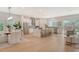 Modern kitchen with white cabinets, stainless steel appliances, and an island at 2492 S Milmar Dr, Sarasota, FL 34237