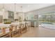 Modern kitchen with island, white cabinets, and stainless steel appliances at 2492 S Milmar Dr, Sarasota, FL 34237